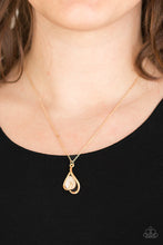 Load image into Gallery viewer, Shimmery gold bars curl around a glowing teardrop moonstone, creating an elegant heart shaped pendant below the collar. Features an adjustable clasp closure.