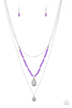 Load image into Gallery viewer, MILD WILD - PURPLE - Paparazzi Infused with vivacious purple beading and an ornate silver teardrop pendant, a colorfully beaded strand gives way to a plain silver chain and a dainty silver chain featuring an antiqued pendant for a whimsically layered look. Features an adjustable clasp closure. Includes one pair of matching earrings.