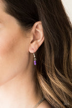 Load image into Gallery viewer, MILD WILD - PURPLE - Paparazzi Infused with vivacious purple beading and an ornate silver teardrop pendant, a colorfully beaded strand gives way to a plain silver chain and a dainty silver chain featuring an antiqued pendant for a whimsically layered look. Features an adjustable clasp closure. Includes one pair of matching earrings.