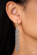 Load image into Gallery viewer, Mismatched silver chains layer below the collar for a bold industrial look. Painted in a neutral finish, a shiny gray chain drapes between the shimmery silver chains for a vivacious finish. Features an adjustable clasp closure. Sold as one individual necklace by Paparazzi. Includes one pair of matching earrings.
