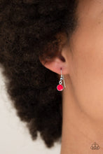 Load image into Gallery viewer, LUNAR LOTUS - Paparazzi - A silver floral pendant swings from the uppermost chain, above a strand of faceted pink beads swinging from a shimmery silver chain. A silver crescent frame swings from the lowermost chain, creating whimsical layers down the chest. Features an adjustable clasp closure. Sold as one individual necklace. Includes one pair of matching earrings.