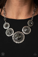 Load image into Gallery viewer, Gradually increasing in size, dramatically oversized smoky gems are pressed into the centers of hammered and silver studded frames. The blinding frames link below the collar for a glamorous, statement-making finish. Features an adjustable clasp closure. Sold as one individual necklace. Includes one pair of matching earrings