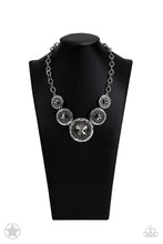 Load image into Gallery viewer, Gradually increasing in size, dramatically oversized smoky gems are pressed into the centers of hammered and silver studded frames. The blinding frames link below the collar for a glamorous, statement-making finish. Features an adjustable clasp closure. Sold as one individual necklace. Includes one pair of matching earrings