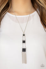 Load image into Gallery viewer, THIS LAND IS YOUR LAND - BLACK - Paparazzi - Square silver frames featuring black stone centers, gradually increase in size as they link down the chest. Shimmery silver chains stream from the bottom, adding movement. Features an adjustable clasp closure. Sold as one individual necklace. Includes one pair of matching earrings.
