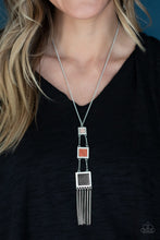 Load image into Gallery viewer, Square silver frames featuring brown, terracotta, and black stone centers, gradually increase in size as they link down the chest. Medium length. Shimmery silver chains stream from the bottom, adding movement. Features an adjustable clasp closure.