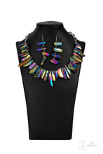 Load image into Gallery viewer, Featuring an oil spill iridescence, raw cut pieces of hematite are threaded along an invisible wire below the collar for a colorfully courageous look. Features an adjustable clasp closure.