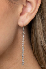 Load image into Gallery viewer, Featuring a faceted surface, a dewy yellow acrylic gem swings from the bottom of a lengthened silver chain. A shimmery silver chain tassel attaches to the bottom of the colorful pendant, adding flirtatious movement. Features an adjustable clasp closure.