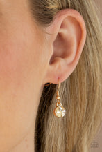 Load image into Gallery viewer, Featuring mismatched round, oval, and square cuts, a golden row of dramatically oversized rhinestones delicately link below the collar for an icy finish. Features an adjustable clasp closure. Sold as one individual necklace. Includes one pair of matching earrings.