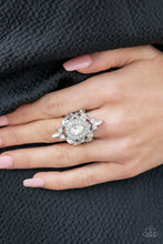 Load image into Gallery viewer, Featuring classic round and regal marquise cuts, dainty white rhinestones delicately join into a stellar frame. Encrusted in glassy white rhinestones, an oversized teardrop gem sits atop the center of a sparkly backdrop for a jaw-dropping finish. Features a stretchy band for a flexible fit. EXCLUSIVE EMPOWER ME PINK 2021 PIECE