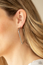 Load image into Gallery viewer, A deceptively simple square frame is tilted on point to create a geometric hoop. Its sharp angles are complemented by its shiny silver finish, making a lasting impression. Earring attaches to a standard post fitting. Hoop measures approximately 2" in diameter. Sold as one pair of hoop earrings by Paparazzi.