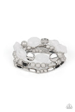 Load image into Gallery viewer, Marina Magic - Paparazzi - Infused with enchanting pops of white crystal-like and glassy accents, a mismatched assortment of hammered, cube, and faceted silver beads are threaded along stretchy bands around the wrist, creating shimmery layers.