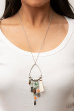 Load image into Gallery viewer, Listen to Your Soul - Green - Paparazzi - Infused with a multicolored collection of natural stone beads and pebbles, stacks of textured silver charms and mismatched wooden beads create earthy tassels at the bottom of a silver beaded teardrop frame. Enhanced with a shiny white threaded tassel, the whimsical fringe swings from the bottom of an extended silver chain.