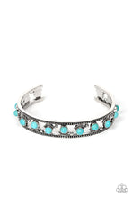 Load image into Gallery viewer, Paparazzi - Badlands Bliss - Blue - Seemingly floating inside the center of a studded silver cuff, dainty turquoise stone beads are fitted in place with shiny silver studs and textured silver frames that alternate along the top and bottom of the stone pieces for an artisan inspired fashion.