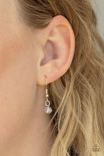 Load image into Gallery viewer, Promoted to Grandma - White - Paparazzi - Infused with a strand of iridescent crystal-like beads, two dainty rows of mismatched silver chains delicately layer below the collar. Stamped in the word, "Grandma," a shiny silver disc swings from the lowest chain, creating a loving pendant.