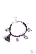 Load image into Gallery viewer, Paparazzi - Outdoor Enthusiast - Multi-Color - This Black Diamond Encore is back in the spotlight:  Shiny blue, red, and purple cording weaves into a colorful braid across the wrist. Radiant silver charms and a soft threaded tassel swing from the wrist in a free-spirited, wanderlust fashion.
