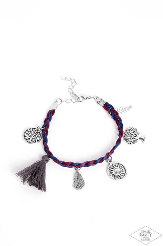 Paparazzi - Outdoor Enthusiast - Multi-Color - This Black Diamond Encore is back in the spotlight:  Shiny blue, red, and purple cording weaves into a colorful braid across the wrist. Radiant silver charms and a soft threaded tassel swing from the wrist in a free-spirited, wanderlust fashion.