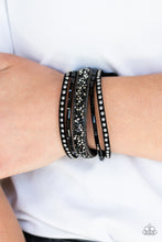 Load image into Gallery viewer, Featuring edgy emerald and prism style cuts, black and hematite rhinestones are encrusted down the center of a black suede band that has been spliced into three. Shiny gunmetal studs and glistening gunmetal chains are added for a sassy industrial finish. Features an adjustable snap closure.
