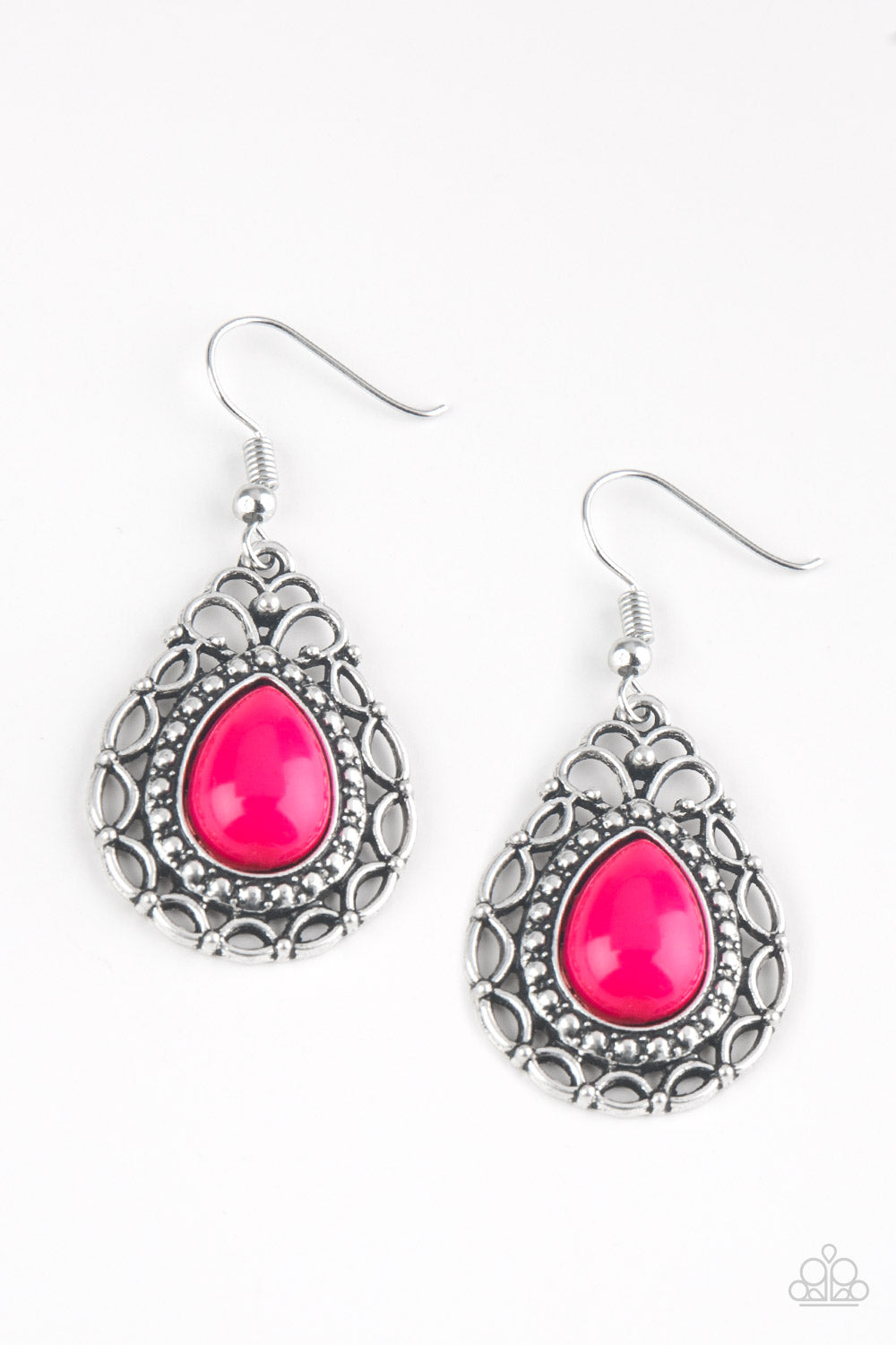 A pink teardrop bead is pressed into a shimmery silver frame radiating with whimsical filigree and studded patterns. Earring attaches to a standard fishhook fitting.