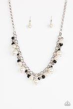 Load image into Gallery viewer, Varying in size, bubbly white pearls, classic silver beads, and shiny black beads swing from the bottom of a glistening silver chain, creating a refined fringe below the collar. Features an adjustable clasp closure.
