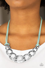 Load image into Gallery viewer, Strands of blue suede knot around interconnecting silver links, creating a bold pendant below the collar. Features an adjustable clasp closure
