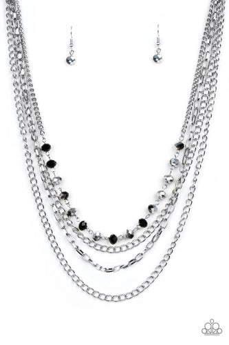 Extravagant Elegance - Multi- Paparazzi  - Mismatched silver chains layer down the chest. Dipped in a metallic sheen, a strand of faceted black beads joins below the collar for a glamorous look. Features an adjustable clasp closure.