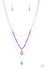 Load image into Gallery viewer, MILD WILD - PURPLE - Paparazzi Infused with vivacious purple beading and an ornate silver teardrop pendant, a colorfully beaded strand gives way to a plain silver chain and a dainty silver chain featuring an antiqued pendant for a whimsically layered look. Features an adjustable clasp closure. Includes one pair of matching earrings.
