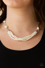 Load image into Gallery viewer, Oversized white pearls and crystal-like beads give way to layers of beaded pearl strands below the collar for a timeless look. Features an adjustable clasp closure.

