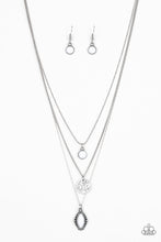 Load image into Gallery viewer, Three mismatched silver chains layer below the collar. A round white bead swings from the uppermost chain, above a scratched silver disc, and marquise-shaped white bead for a layered look. Features an adjustable clasp closure.  Sold as one individual necklace. Includes one pair of matching earrings.
