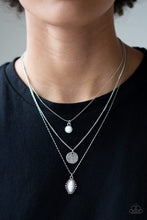 Load image into Gallery viewer, Three mismatched silver chains layer below the collar. A round white bead swings from the uppermost chain, above a scratched silver disc, and marquise-shaped white bead for a layered look. Features an adjustable clasp closure.  Sold as one individual necklace. Includes one pair of matching earrings.
