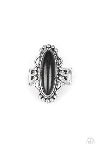 An oblong black stone is pressed into the center of an ornate silver frame for a seasonal look. Features a stretchy band for a flexible fit.  Sold as one individual ring.
