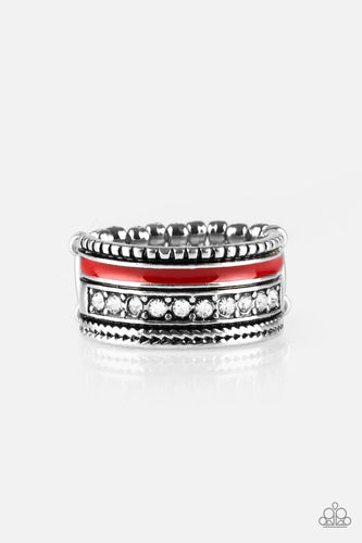 A shiny red strip of color runs along the bottom of a row of glassy white rhinestones. Infused with silver textures, the mismatched details coalesce into one thick band across the finger. Features a stretchy band for a flexible fit.