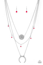 Load image into Gallery viewer, LUNAR LOTUS - Paparazzi - A silver floral pendant swings from the uppermost chain, above a strand of faceted pink beads swinging from a shimmery silver chain. A silver crescent frame swings from the lowermost chain, creating whimsical layers down the chest. Features an adjustable clasp closure.  Sold as one individual necklace. Includes one pair of matching earrings.

