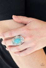 Load image into Gallery viewer, A refreshing turquoise stone is pressed into a shimmery silver frame embossed in swirling details for an artisan inspired look. Features a stretchy band for a flexible fit.
