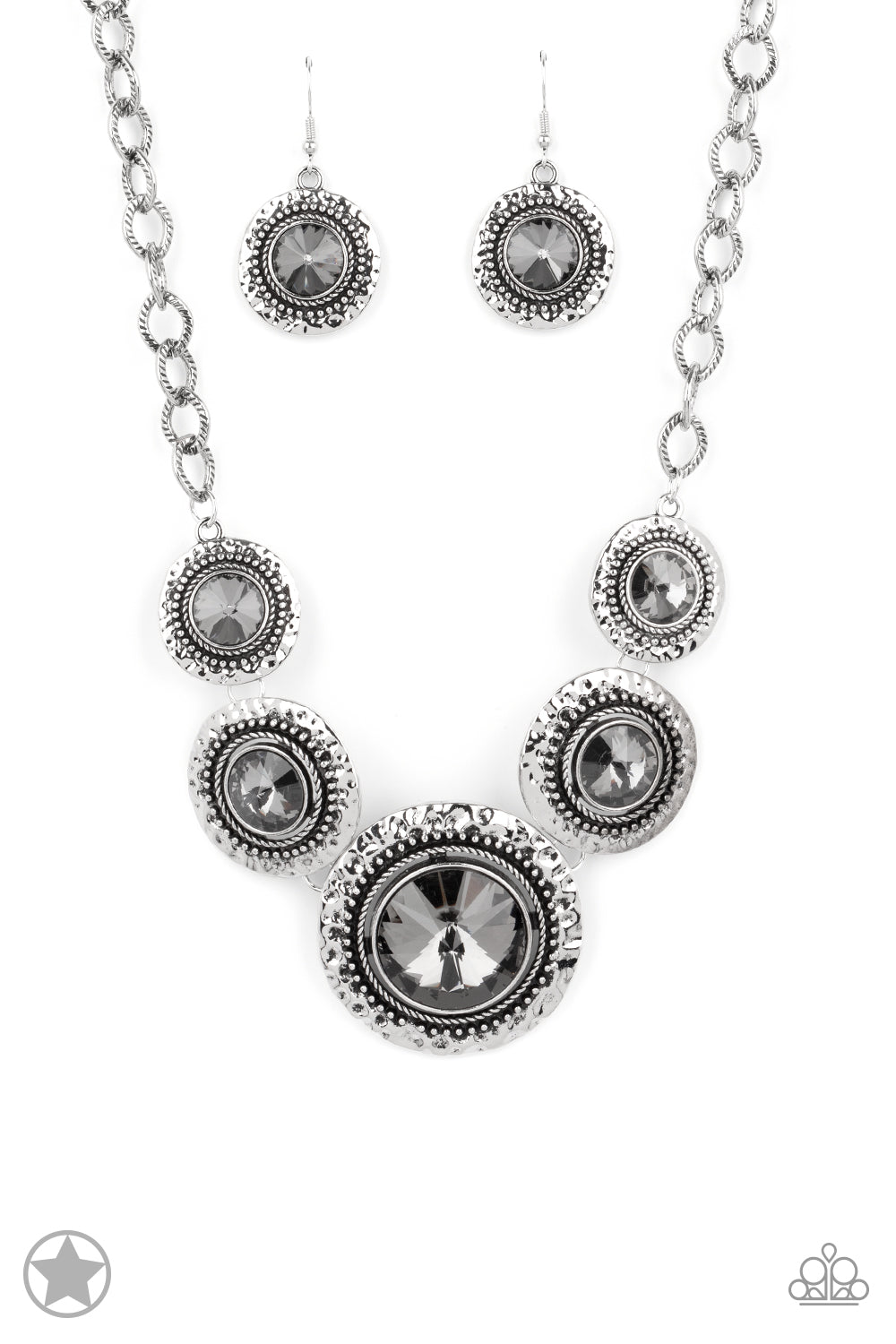 Gradually increasing in size, dramatically oversized smoky gems are pressed into the centers of hammered and silver studded frames. The blinding frames link below the collar for a glamorous, statement-making finish. Features an adjustable clasp closure.  Sold as one individual necklace. Includes one pair of matching earrings
