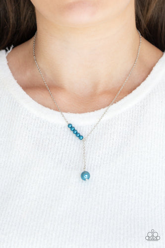 A solitaire blue pearl swings from the bottom of a glistening silver chain, creating a timeless extended pendant below the collar. A section of dainty blue pearls dot one side of the chain for a refined asymmetrical finish. Features an adjustable clasp closure.