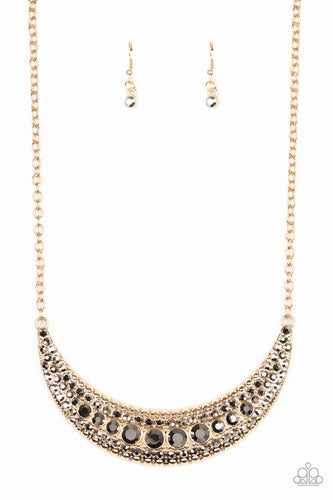 Varying in size, row after row of smoky hematite rhinestones are encrusted along the front of a studded half moon gold frame, creating a glittery statement below the collar. Features an adjustable clasp closure.
