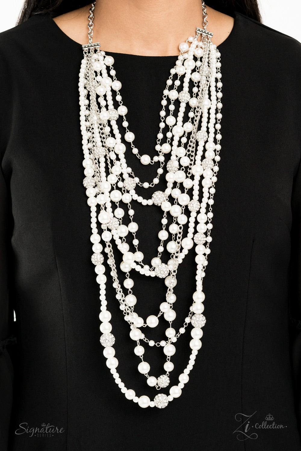 Paparazzi ZI Signature - The LeCricia - An elegant collection of timeless white pearls, shiny sections of silver chain, and bedazzling white rhinestone encrusted silver beads effortlessly cascade down the chest. The vintage inspired layers drape into breathtaking rows of radiance, resulting in an irresistible collision of romance. Features an adjustable clasp closure.