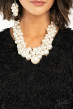 Load image into Gallery viewer, Zi Collection 2020 - An exaggerated display of clustered pearls elegantly sweeps below the collar. The classic white pearls gradually increase in bubbly intensity as they reach the center of the regal piece, adding over-the-top timelessness to the unapologetic pearl palette. Features an adjustable clasp closure. Sold as one individual necklace. Includes one pair of matching earrings.

