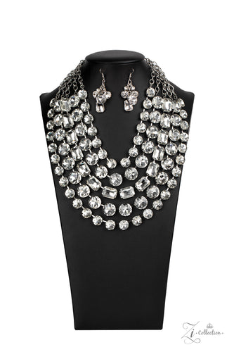 Featuring round and emerald style cuts, row after row of dramatically oversized white rhinestones delicately link into blinding layers below the collar. Featuring sleek silver fittings, each rhinestone in this megawatt mashup demands attention. Features an adjustable clasp closure.