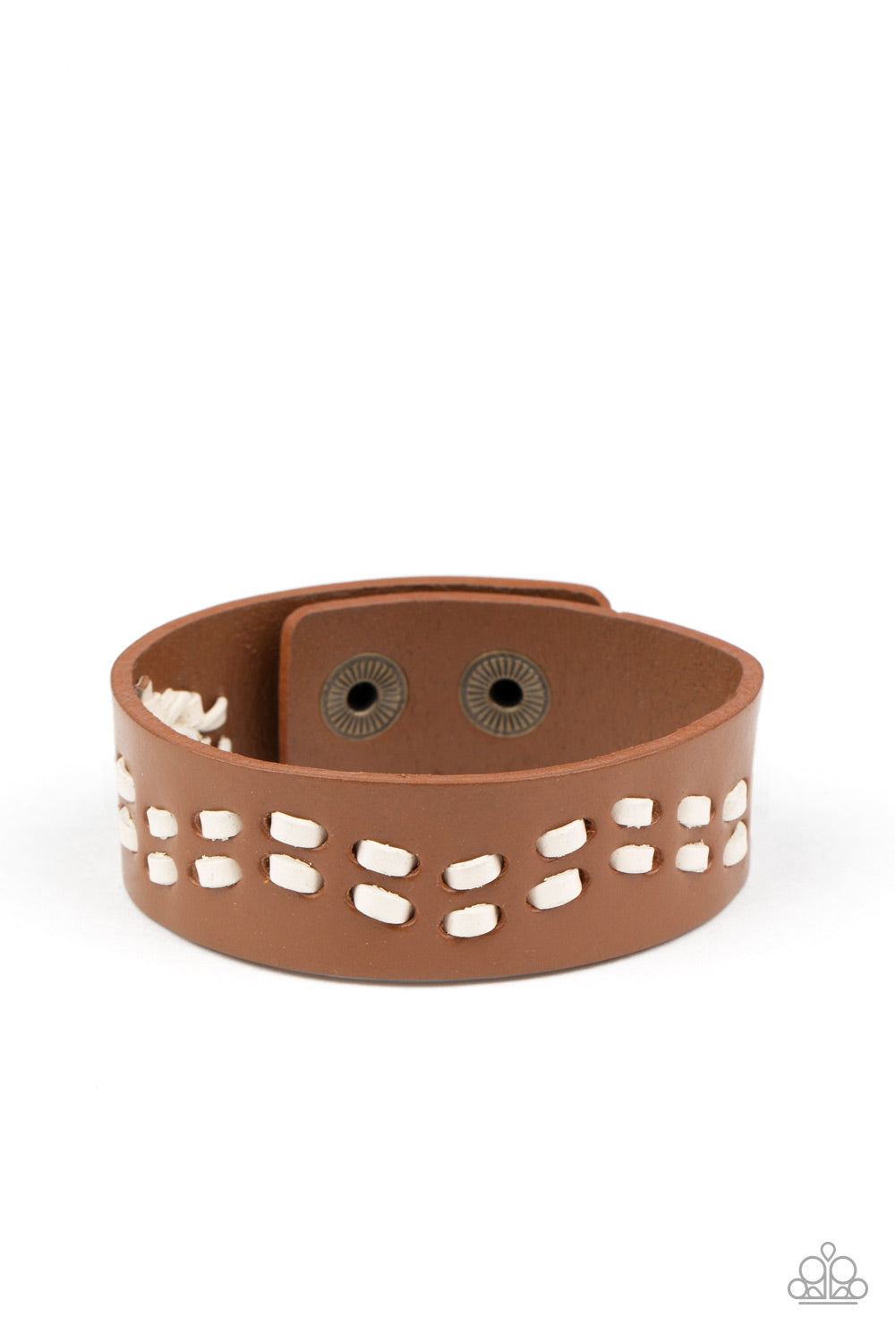 White leather cording is haphazardly laced through the center of a brown leather band, creating a rustic look around the wrist. Features an adjustable snap closure.