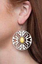 Load image into Gallery viewer, SOUTHWEST WALKABOUT - Paparazzi - An oval yellow bead adorns the center of a round silver frame radiating with an airy southwestern inspired pattern for a whimsical look. Earring attaches to a standard fishhook fitting.  Sold as one pair of earrings.
