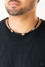 Load image into Gallery viewer, Sections of hammered silver discs and stamped brass rings are knotted in place along strands of shiny black cording that loops around the neck for a rustic look. Features a button loop closure.

