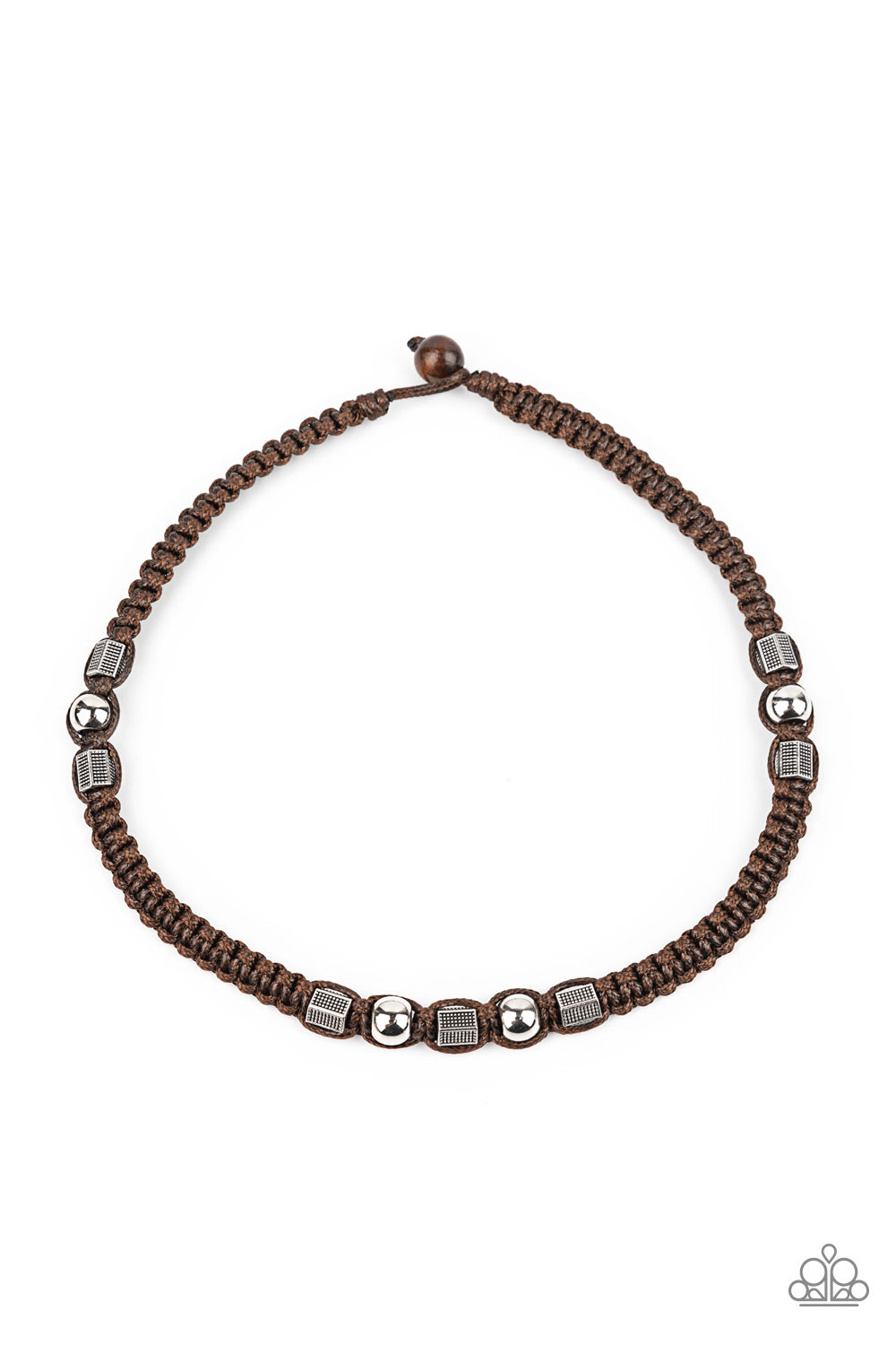 Sections of shiny silver beads and studded hexagonal accents are knotted in place along a brown cord that has been braided around the neck. Features a wooden toggle closure.