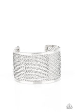 Load image into Gallery viewer, Twisted rows of silver wire layer between two flat silver bars, coalescing into a boldly stacked cuff around the wrist.
