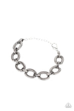 Load image into Gallery viewer, Stamped in snake chain detail, antiqued silver ovals and matching silver links interlock across the wrist for a wild industrial look. Features an adjustable clasp closure.
