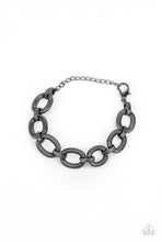 Load image into Gallery viewer, Stamped in snake chain detail, shiny gunmetal ovals and matching gunmetal links interlock across the wrist for a wild industrial look. Features an adjustable clasp closure.
