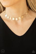 Load image into Gallery viewer, Paparazzi - Reflection Detection - Gold - Hammered in shimmery detail, a shiny collection of dainty gold discs delicately link into a blinding display around the neck.
