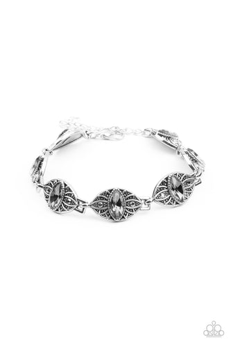 Featuring smoky marquise rhinestone centers, silver studded floral frames are dotted in dainty hematite rhinestones as they link around the wrist for a regal flair. Features an adjustable clasp closure.