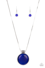 Load image into Gallery viewer, Attached to a decorative silver fitting, a dramatically oversized blue cat&#39;s eye stone pendant glides along a rounded silver snake chain below the collar for a powerful pop of color. Features an adjustable clasp closure.  Sold as one individual necklace by Paparazzi  Includes one pair of matching earrings.
