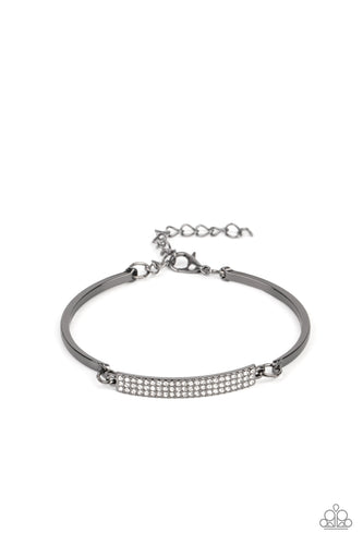 Two arcing gunmetal bands link with a gunmetal frame encrusted in row after row of glassy white rhinestones, creating a sparkly centerpiece around the wrist. Features an adjustable clasp closure.